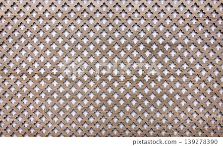 Wooden lattice screen with geometric quatrefoil pattern. Ornamental wood panel for interior design and architecture decoration. Detailed carpentry background for construction texture. 139278390