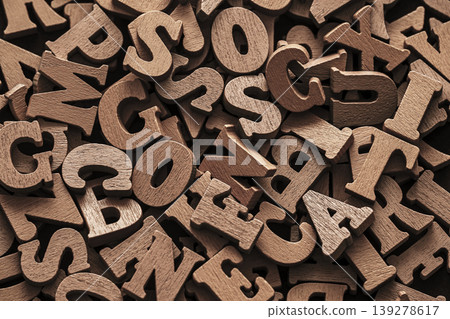 Pile of old vintage wooden letters. Typography background composition. 139278617