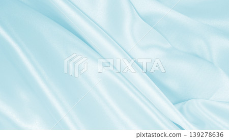 Smooth elegant blue silk or satin luxury cloth texture as abstract background. Luxurious background design Smooth elegant blue silk or satin luxury cloth texture as abstract background. Luxurious background design 139278636