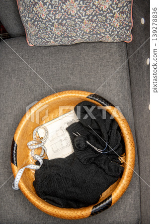Soft black yarn balls with knitting needles in basket Soft black yarn balls with knitting needles in basket 139278836