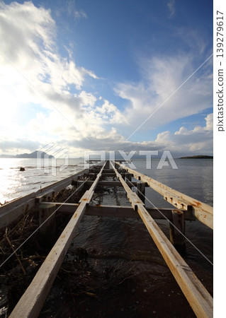 Old abandoned wooden fishing pier on the sea in the countryside Old abandoned wooden fishing pier on the sea in the countryside 139279617