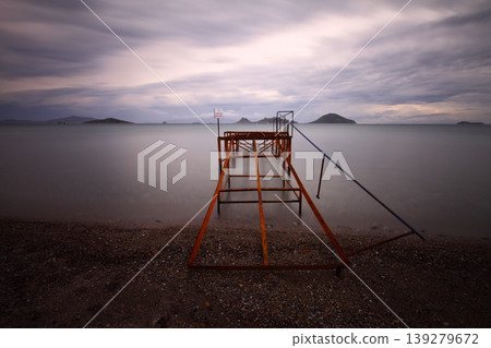 Old abandoned wooden fishing pier on the sea in the countryside Old abandoned wooden fishing pier on the sea in the countryside 139279672