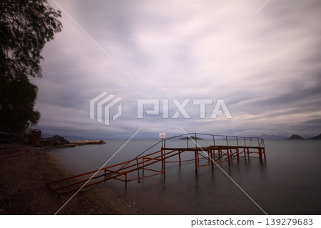 Old abandoned wooden fishing pier on the sea in the countryside Old abandoned wooden fishing pier on the sea in the countryside 139279683
