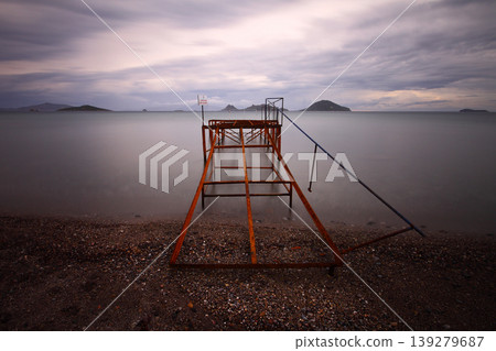 Old abandoned wooden fishing pier on the sea in the countryside 139279687