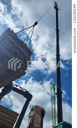Crane lifting a concrete bucket for foundation pouring, industrial building engineering, professional site work Crane lifting a concrete bucket for foundation pouring, industrial building engineering, professional site work 139280549