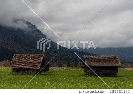 Misty Bavarian Alpine Huts in Green Meadow Misty Bavarian Alpine Huts in Green Meadow 139281132
