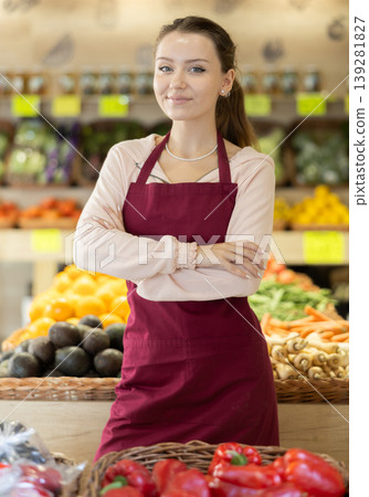Young woman seller in vegetable shop Young woman seller in vegetable shop 139281827