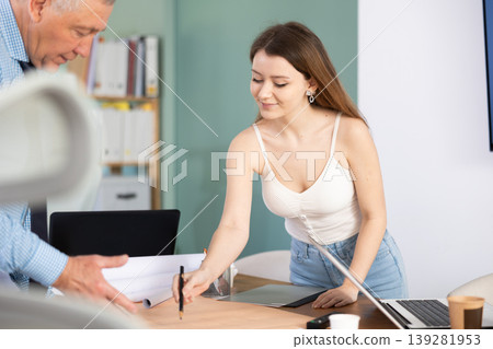 Engineer and architect discussing about blueprint layout design of electricity plan before construction in office Engineer and architect discussing about blueprint layout design of electricity plan before construction in office 139281953
