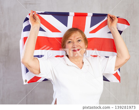 Happy elderly woman posing with flag of United Kingdom Happy elderly woman posing with flag of United Kingdom 139281973