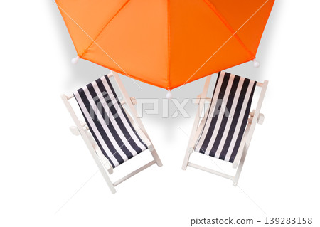 Chairs wait under an umbrella for beachgoers to relax, PNG 139283158