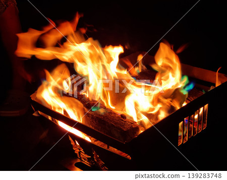 It is a flame rising from a bonfire. It is a flame rising from a bonfire. 139283748