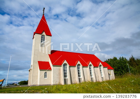 The church on a hill overlooking the fjord, Eyjafjörður, on the outskirts of Akureyri, in the Republic of Iceland, a Nordic island nation. The church on a hill overlooking the fjord, Eyjafjörður, on the outskirts of Akureyri, in the Republic of Iceland, a Nordic island nation. 139283776