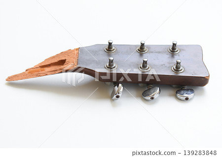 part of broken wood acoustic guitar isolated on white background 139283848