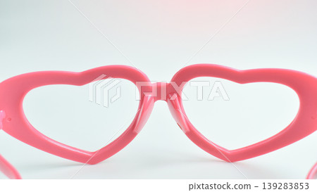pink heart shape of glasses on white background 139283853