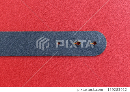 shiny red leather background with dark blue strap shiny red leather background with dark blue strap 139283912