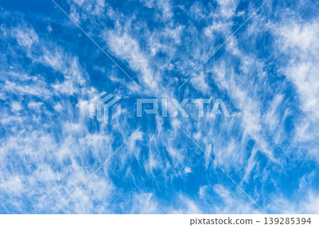 Blue sky with scattered clouds natural background texture Blue sky with scattered clouds natural background texture 139285394