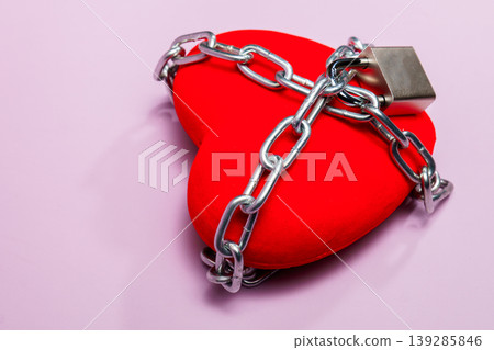 Red heart chained with padlock symbolizing love protection Red heart chained with padlock symbolizing love protection 139285846
