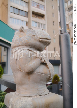 A sculpture of an hippo figure stands outside A sculpture of an hippo figure stands outside 139286442