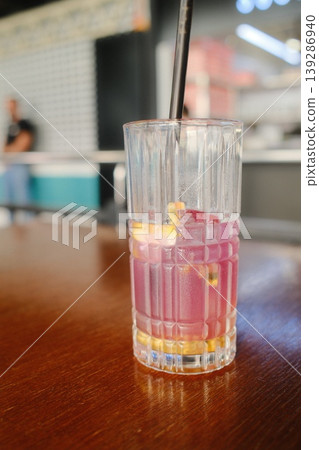 A refreshing drink sits on a table inside a cafe background A refreshing drink sits on a table inside a cafe background 139286940