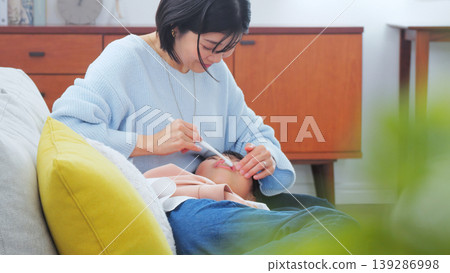 Image of a mother brushing her teeth Image of a mother brushing her teeth 139286998