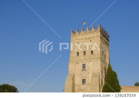 The tower shows the Flag of Ukraine waving from the top of Lubart's Castle The tower shows the Flag of Ukraine waving from the top of Lubart's Castle 139287039