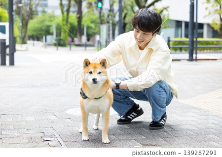 Lifestyle, Pets, A man walking his Shiba Inu Lifestyle, Pets, A man walking his Shiba Inu 139287291