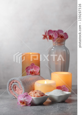 Sea salt, towels, orchid flowers, and burning candles. Sea salt, towels, orchid flowers, and burning candles. 139287316
