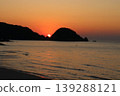 A miraculous sunset shining through the strangely shaped rock formations of Higashihama Cave 139288121