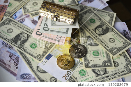 Two Bitcoin coins, a chest of dollars, and a Euro banknote Two Bitcoin coins, a chest of dollars, and a Euro banknote 139288679