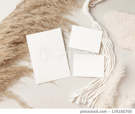Blank wedding cards suite mockup with pampas grass on beige stone top view, boho wedding stationery Blank wedding cards suite mockup with pampas grass on beige stone top view, boho wedding stationery 139288700