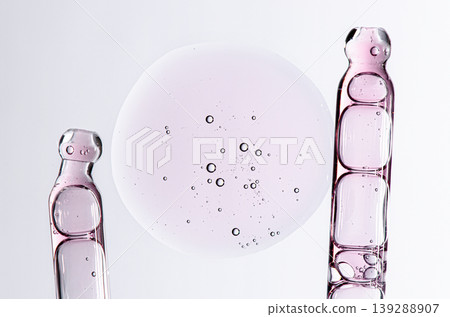 Skin serum in a pipette. A cosmetic product for body care. White background. Skin serum in a pipette. A cosmetic product for body care. White background. 139288907