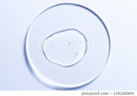 Skin serum or moisturizer or shower gel on a glass circle. A cosmetic product for body care. Skin serum or moisturizer or shower gel on a glass circle. A cosmetic product for body care. 139288909
