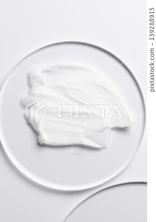 A sample of a cosmetic product. A moisturizing gel or shaving cream or body milk. 139288915