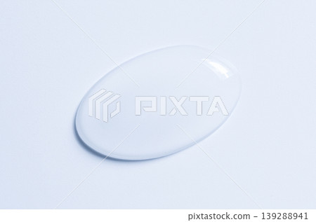 Cosmetic product in the form of a transparent drop. A moisturizing gel or serum for the face. Cosmetic product in the form of a transparent drop. A moisturizing gel or serum for the face. 139288941