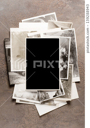 Lots of old vintage photos. Copy space. Brown background. Lots of old vintage photos. Copy space. Brown background. 139288943