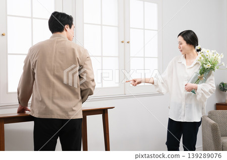 A young man and woman carrying furniture - Lifestyle image A young man and woman carrying furniture - Lifestyle image 139289076