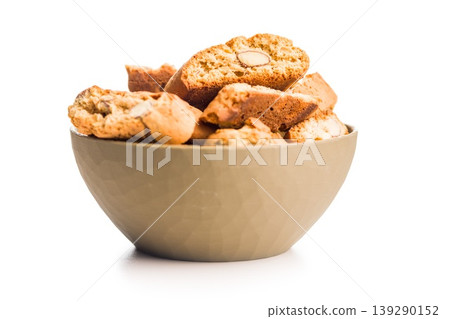 Grissini. Almond Biscotti Cookies in a Bowl With Rustic Crunchy Italian Biscotti isolated on white background. Grissini. Almond Biscotti Cookies in a Bowl With Rustic Crunchy Italian Biscotti isolated on white background. 139290152