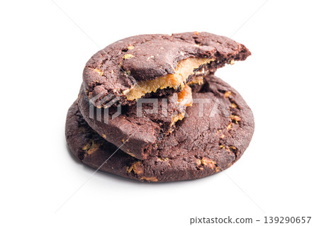 Chocolate Cookies With Caramel Filling Stacked and Broken Bite on White Background 139290657
