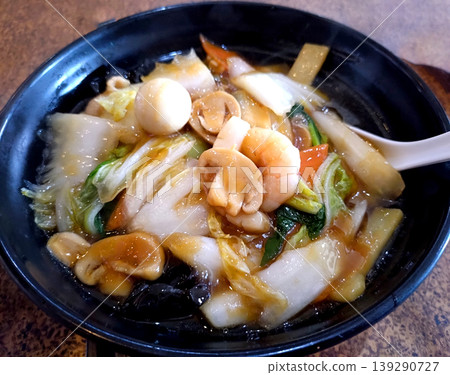 Delicious mixed ramen served in a black bowl Delicious mixed ramen served in a black bowl 139290727
