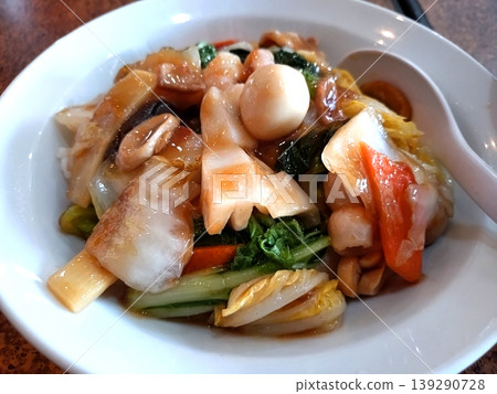 Delicious Chinese rice served in a white bowl Delicious Chinese rice served in a white bowl 139290728