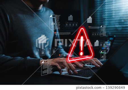 Data security warning and cyber risk alert concept. Person using laptop with digital files, lock icon, red warning symbol. data breach, document protection, threat detection, secure incident response 139290849