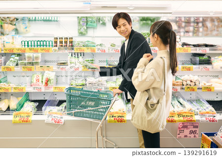 A couple shopping at a supermarket A couple shopping at a supermarket 139291619