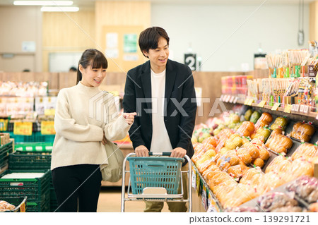 A couple shopping at a supermarket A couple shopping at a supermarket 139291721