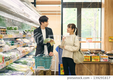 A couple shopping at a supermarket A couple shopping at a supermarket 139291817