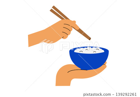The rice in the bowl and the hand holding the chopsticks 139292261