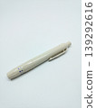Top view of a beige lancing device pen isolated on a white background 139292616