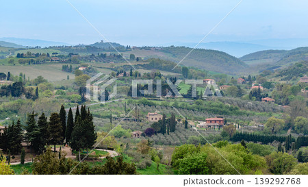 Rolling hills and picturesque vineyards create a tranquil countryside landscape Rolling hills and picturesque vineyards create a tranquil countryside landscape 139292768