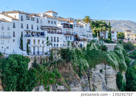 The picturesque town of Ronda in Spain is located on a cliff. The picturesque town of Ronda in Spain is located on a cliff. 139292787