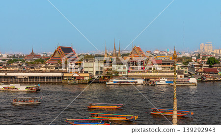 Cityscape view of riverside temples and boats during daytime in Bangkok, Thailand Cityscape view of riverside temples and boats during daytime in Bangkok, Thailand 139292943