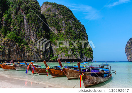 Maya Bay island Phi Phi Leh with longtail boat, turquoise clear water in Krabi Thailand Maya Bay island Phi Phi Leh with longtail boat, turquoise clear water in Krabi Thailand 139292947